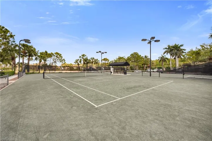 View of tennis court with a gazebo and community basketball court