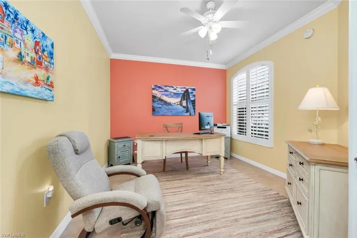 Office space featuring crown molding and a ceiling fan