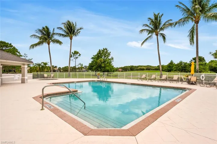 Community pool with a patio area