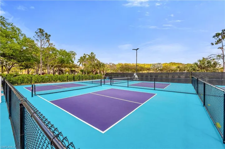 View of tennis court featuring community basketball court
