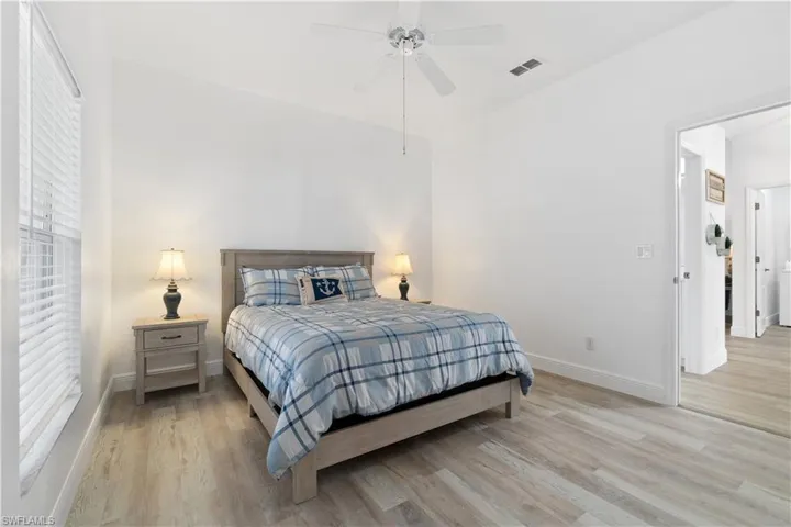 Bedroom featuring ceiling fan and light wood-type flooring