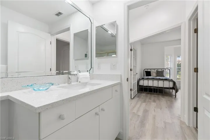 Bathroom with vanity and wood-type flooring