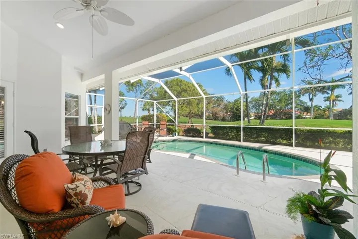 View of pool, the lanai, and golf course.