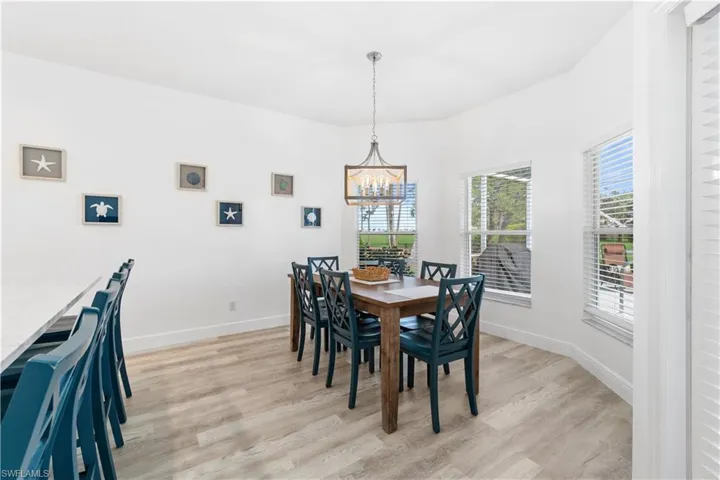 Dining space featuring an inviting chandelier and light hardwood / wood-style flooring