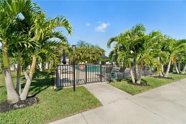 View of gate featuring a community pool