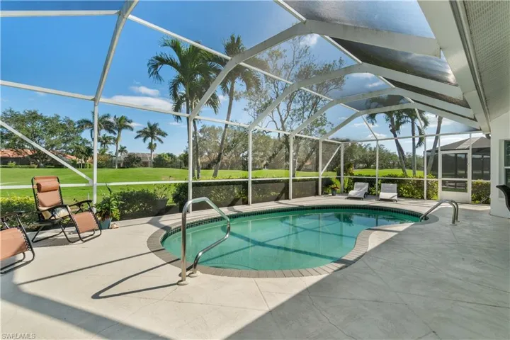 View of pool with a patio, a lanai, and a yard