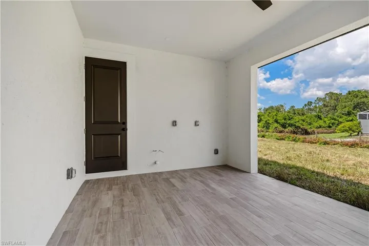 Empty room with light hardwood / wood-style flooring