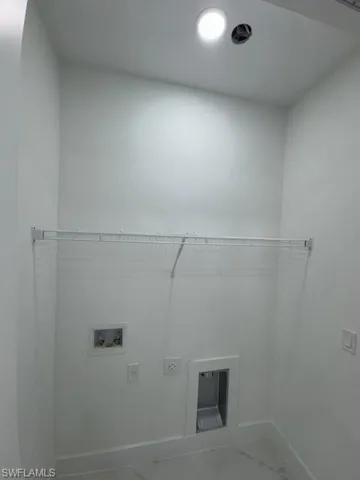Laundry room with washer hookup and hookup for an electric dryer