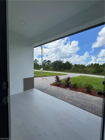 View of front porch, garden and ST.