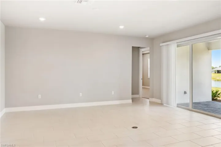 Empty room with recessed lighting and baseboards