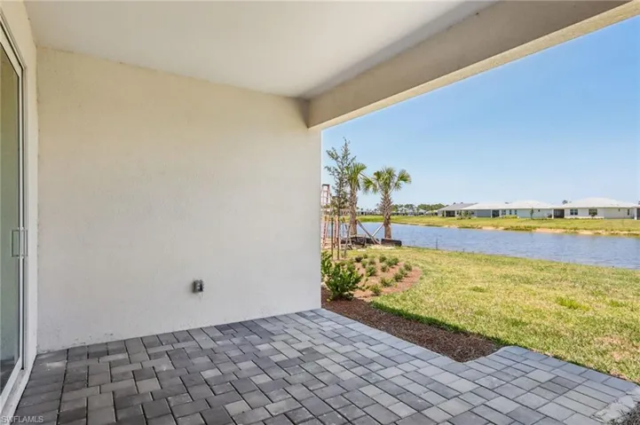 View of patio with a water view and a residential view