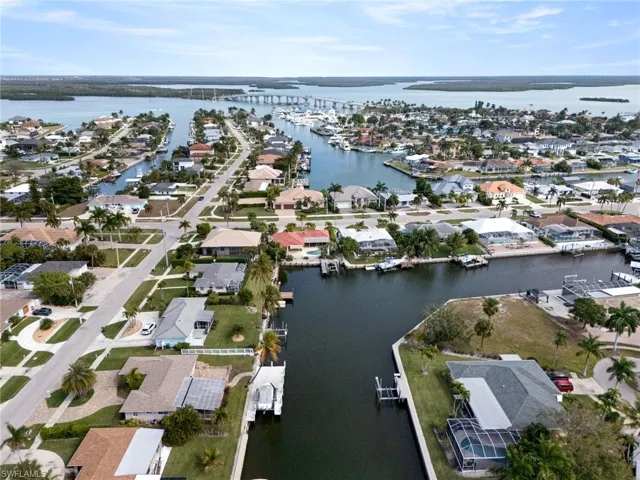 View of property location featuring a large body of water and nearby suburban area