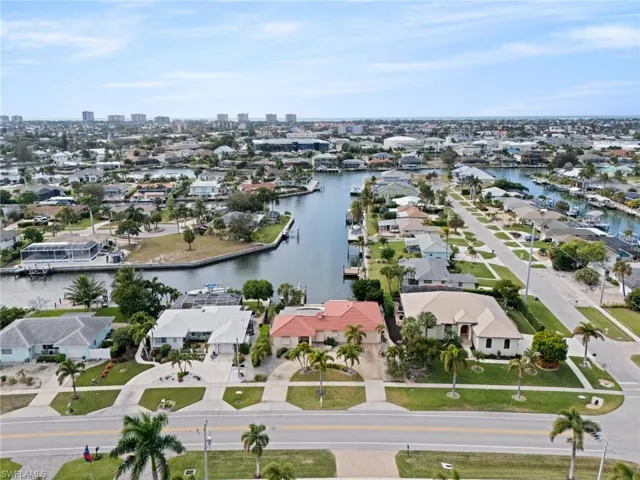 Aerial perspective of suburban area with a nearby body of water
