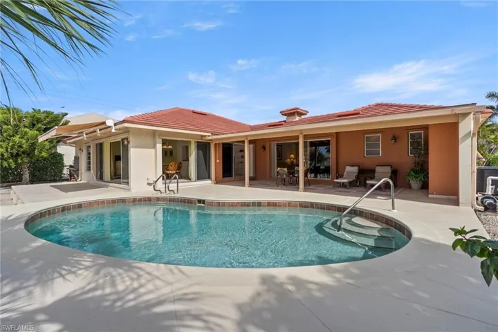 Outdoor pool with a patio
