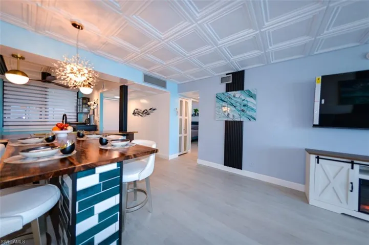 DINING AREA SHOWING ENTRANCE TO GUEST BEDROOM