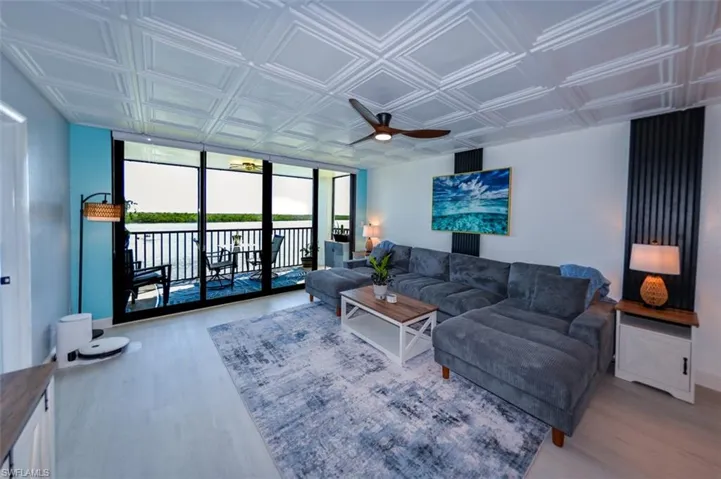 IMPACT GLASS SLIDING DOORS.  DECORATIVE FLUTED WOOD PANEL WALL ACCENTS.  LUXURY VINYL PLANK TILE FLOORING.  PVC CEILING TILE.