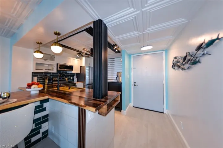 VIEW OF UNIT ENTRANCE.  LUXURY VINYL PLANK TILE FLOORING THROUGHOUT.