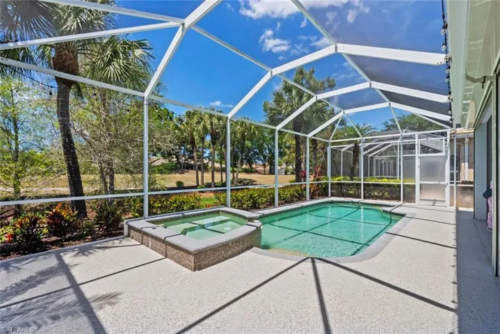 The property features an enclosed patio with a swimming pool and an integrated spa
