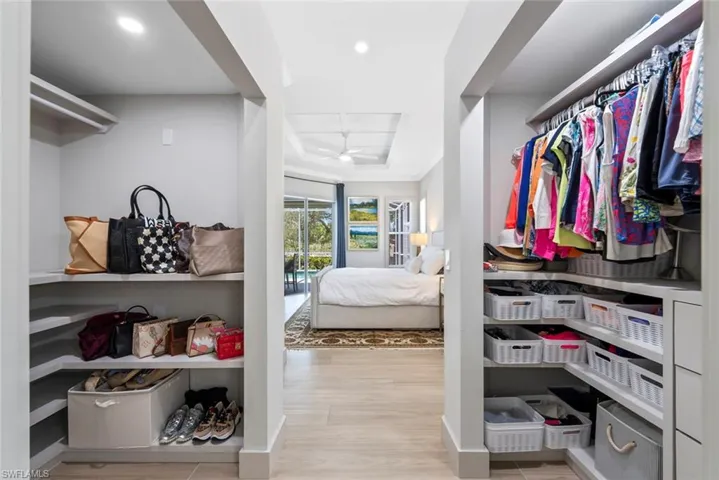 This room features built-in closet storage with shelving and hanging space