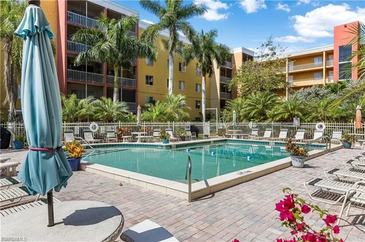 Community pool featuring a patio area