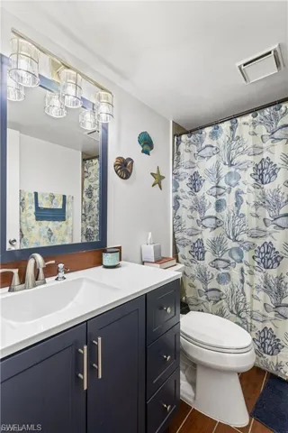 Bathroom featuring vanity and a shower with shower curtain