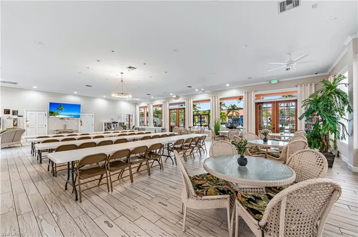 Dining space featuring wood tiled floors, recessed lighting, french doors, and crown molding