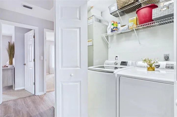 Laundry closet with Samsung washer/dryer plus extra storage