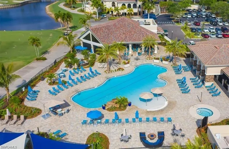 View of pool with a water view