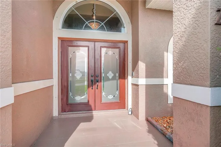 Entrance to property featuring french doors