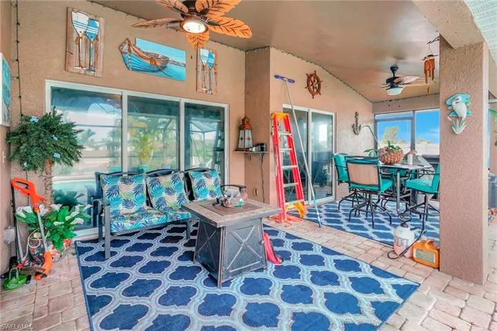 Playroom with vaulted ceiling and ceiling fan