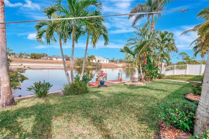 View of yard with a water view