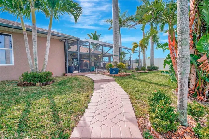 View of yard with a lanai
