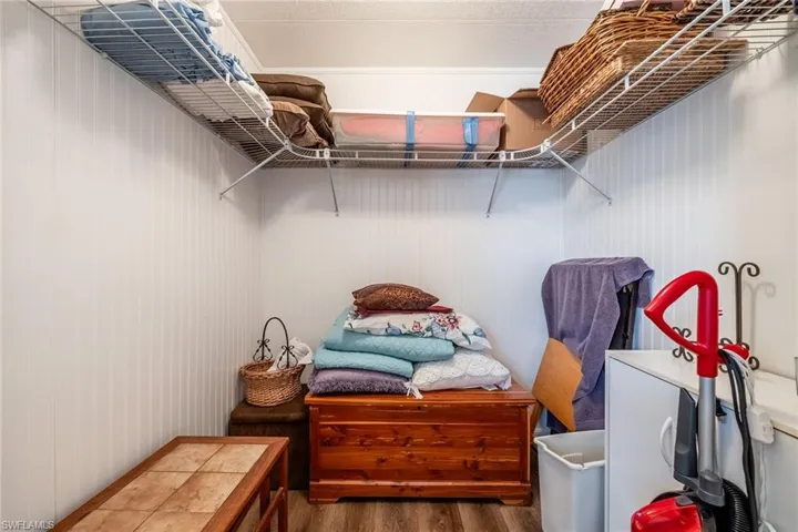 Walk in closet featuring wood finished floors