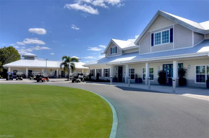 View of front of house featuring uncovered parking, a porch, metal roof, and a front yard