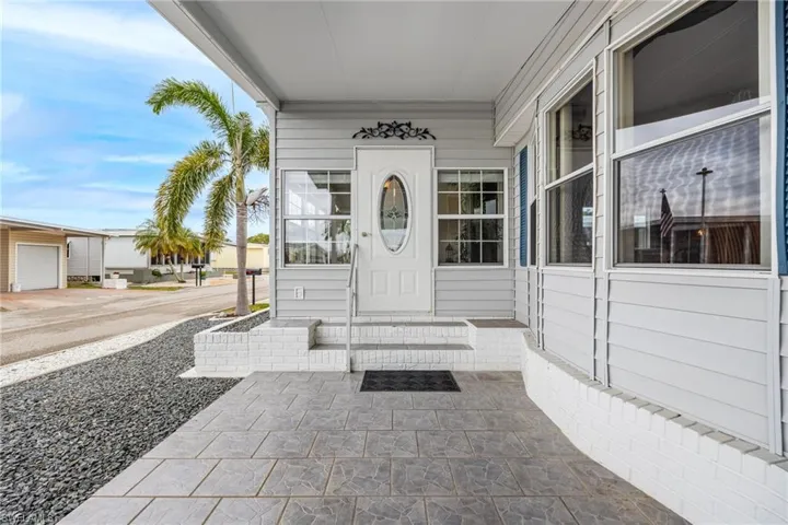 Property entrance with covered porch