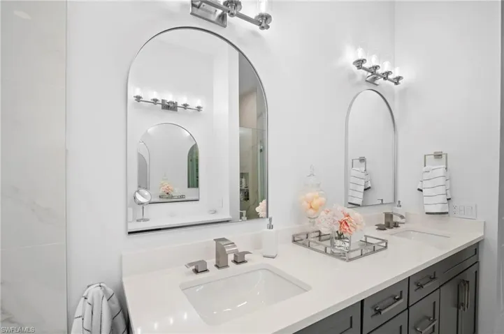 Full bath featuring double vanity