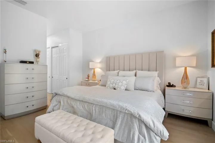 Bedroom featuring a closet and light wood flooring