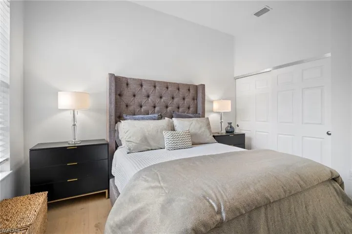 Bedroom featuring a closet and light wood flooring
