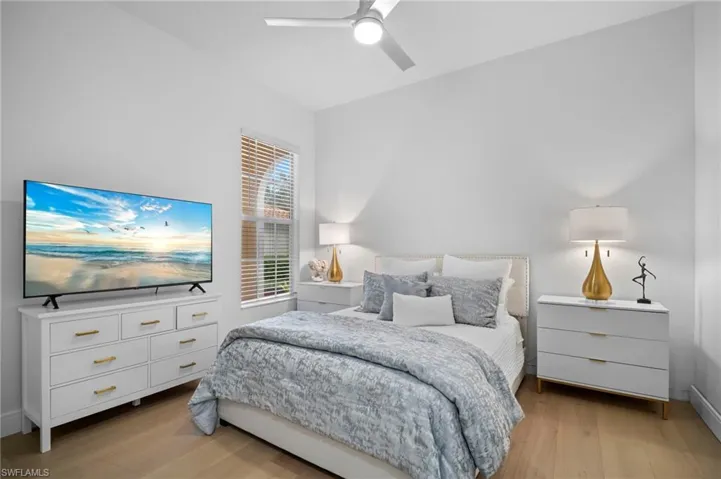 Bedroom with a ceiling fan and light wood finished floors