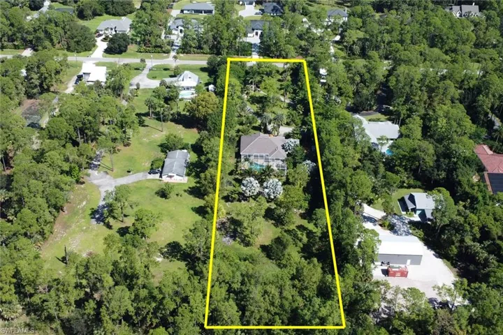 Aerial perspective of suburban area featuring property parcel outlined