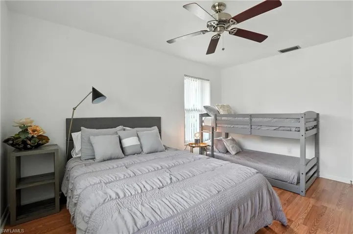 Bedroom with wood finished floors and ceiling fan