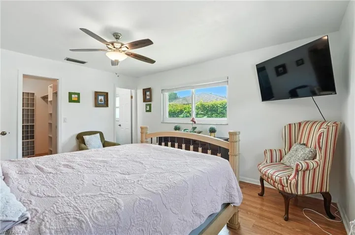 Bedroom featuring wood finished floors and ceiling fan