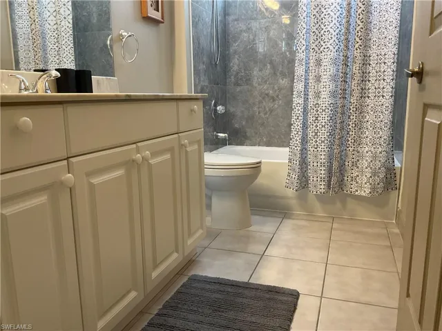 Guest Full bathroom with shower / bath combo, toilet and vanity