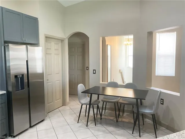 Kitchen has dining table in addition to dining table in great room area
