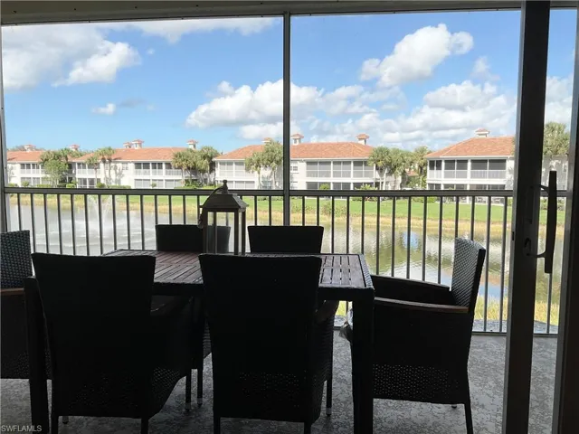 Lanai featuring view of lake and water view
