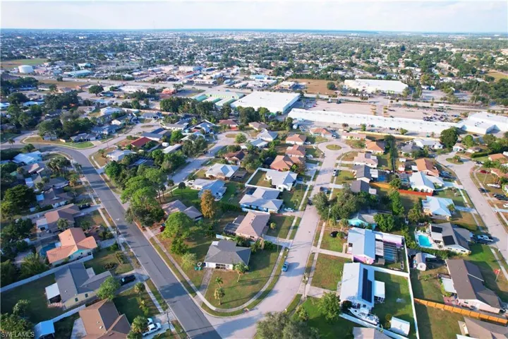 Aerial overview of property's location with nearby suburban area