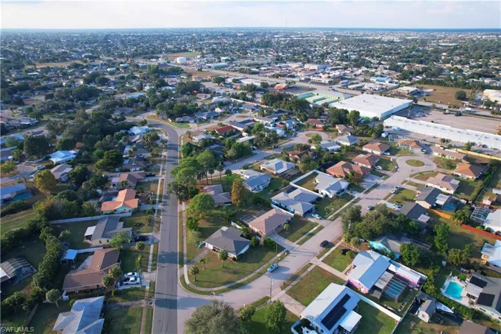Aerial overview of property's location featuring nearby suburban area