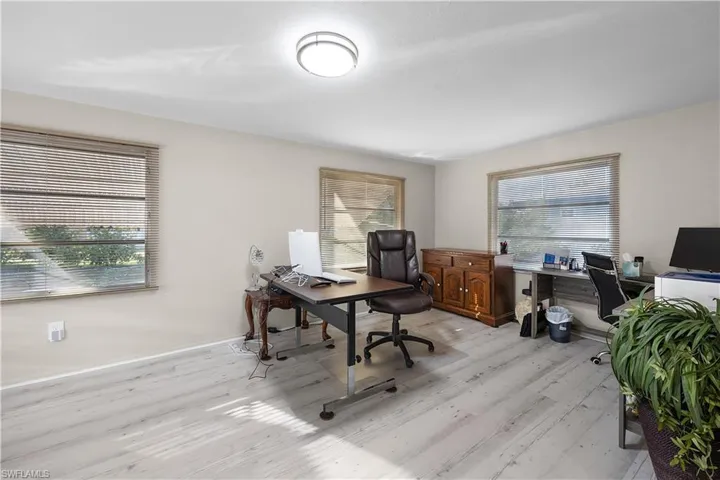 Home office featuring plenty of natural light and light wood-style floors