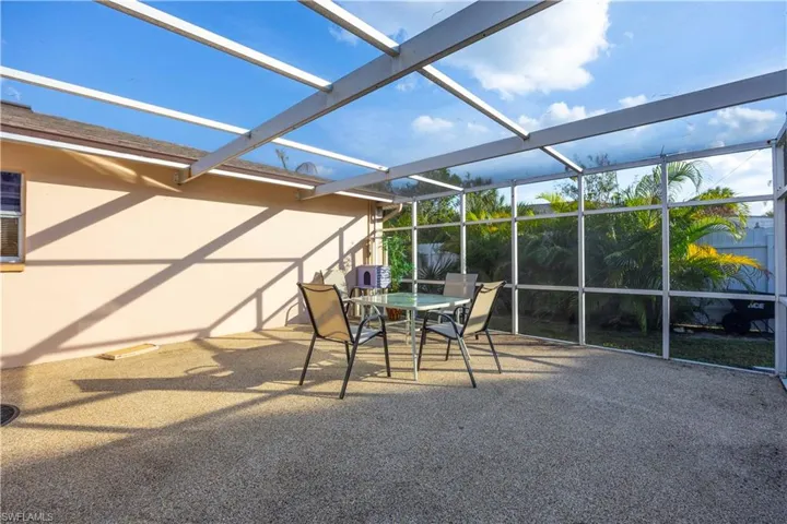 View of patio / terrace with glass enclosure and a sunroom