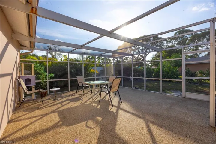 Sunroom / solarium featuring a patio area